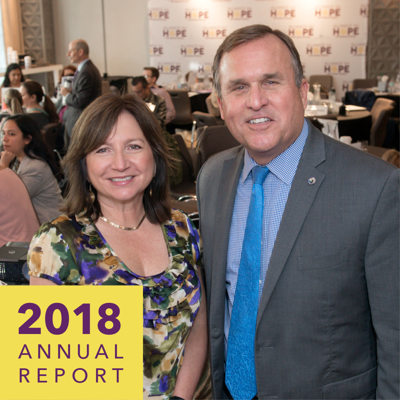 A maand woman smile for the camera. Text reads 2018 annual report.