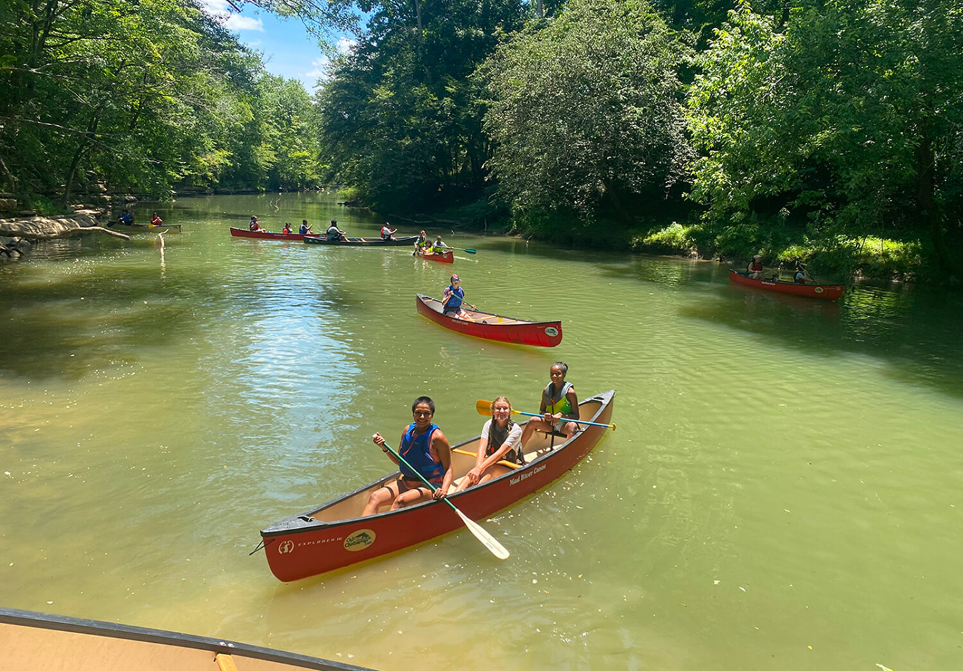 A group of people kayaking on a river
