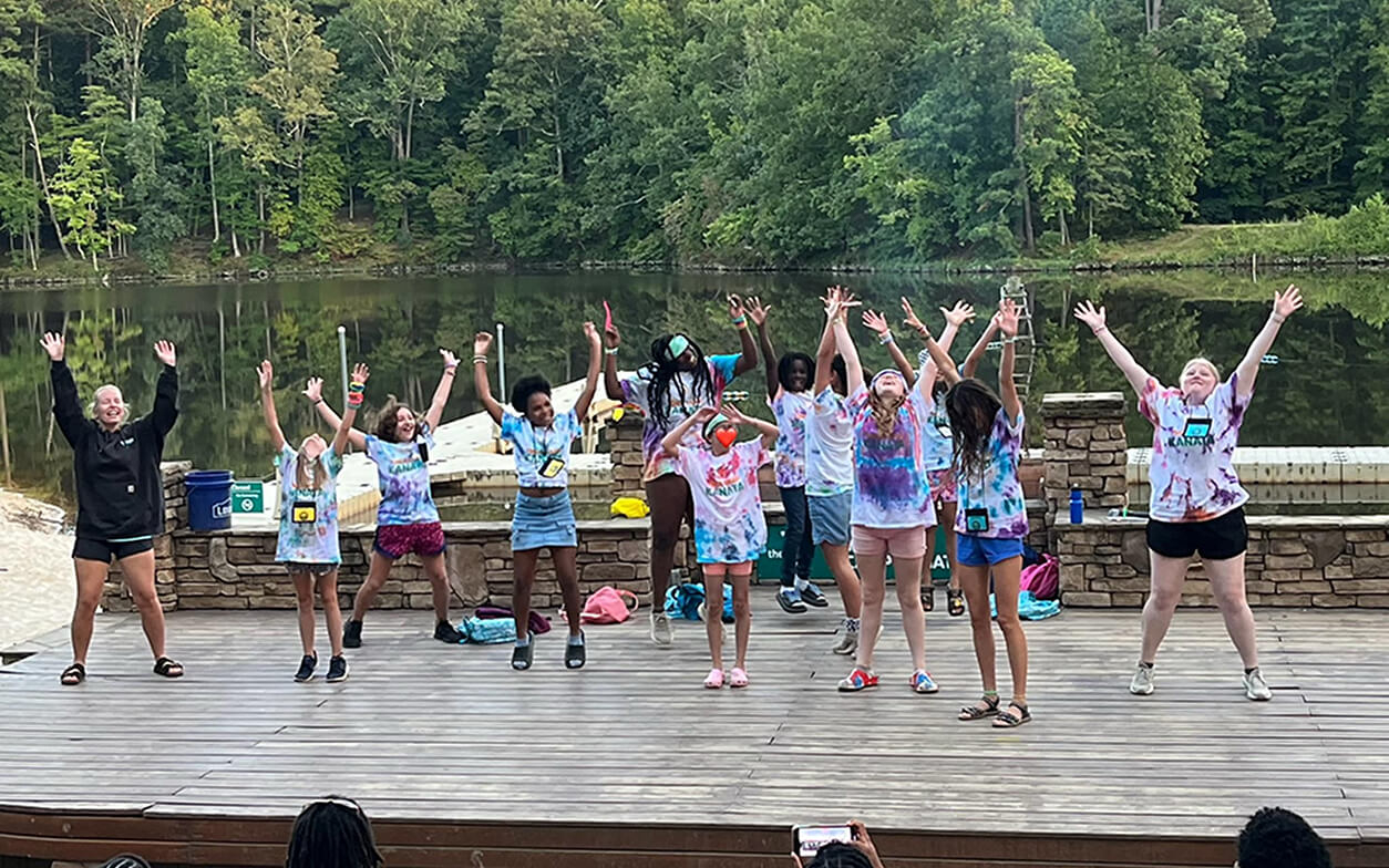 A group of young people performing a choreography.