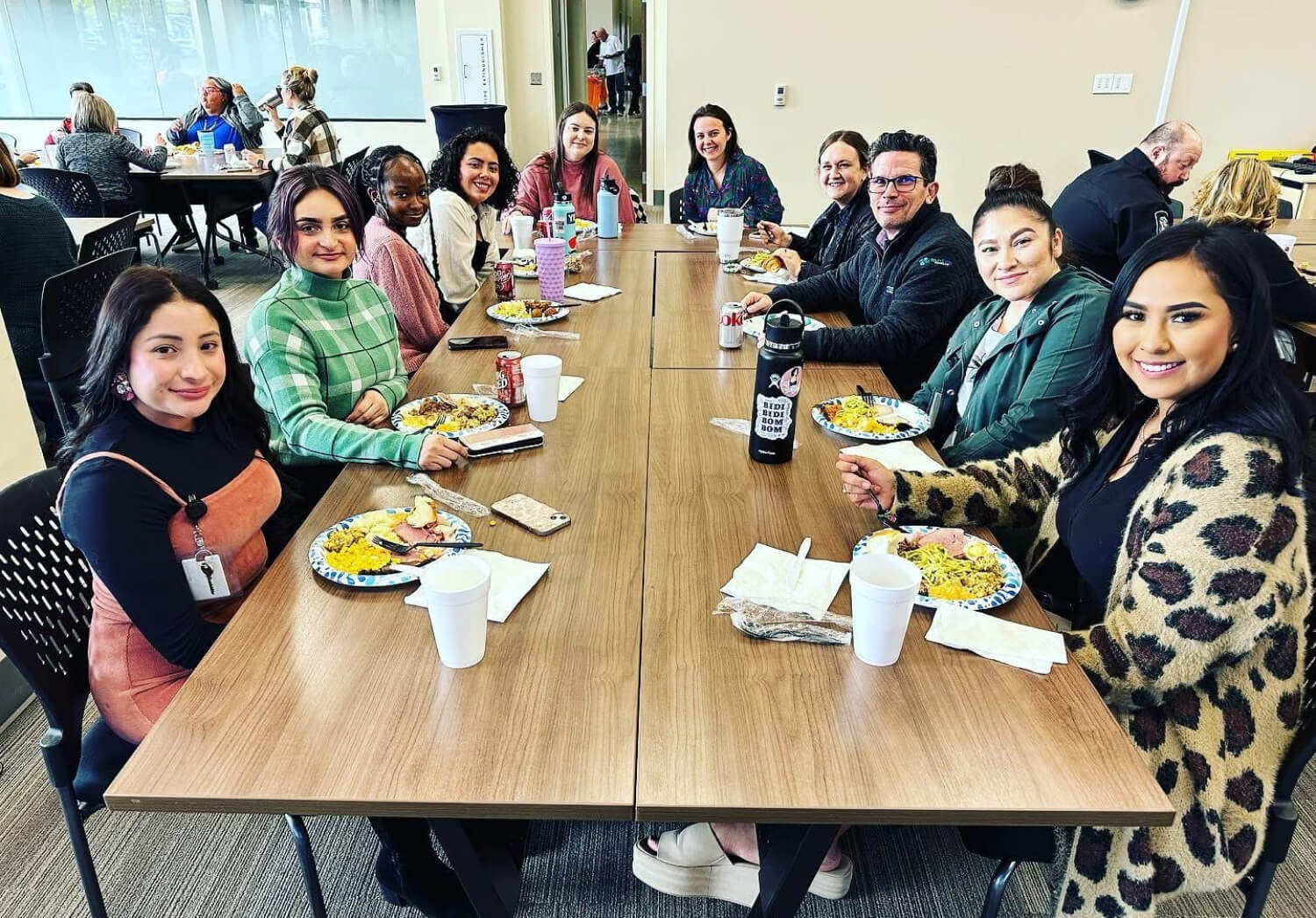 A group of volunteers gathered around a table